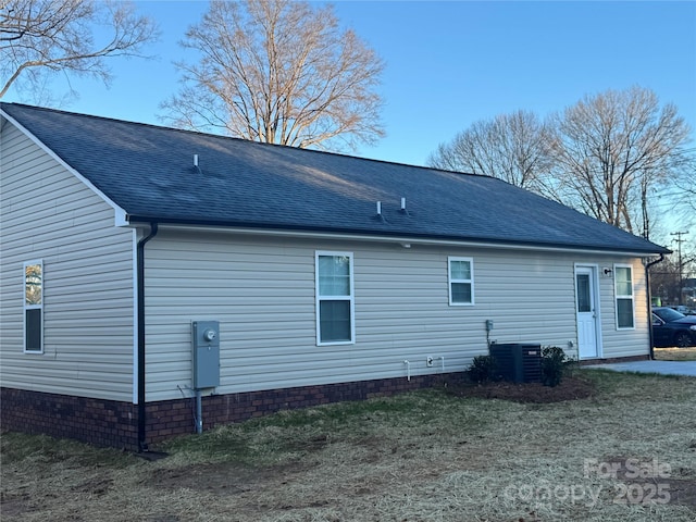 back of house with central AC