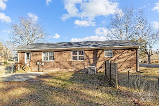 back of property featuring central AC, a yard, and a patio