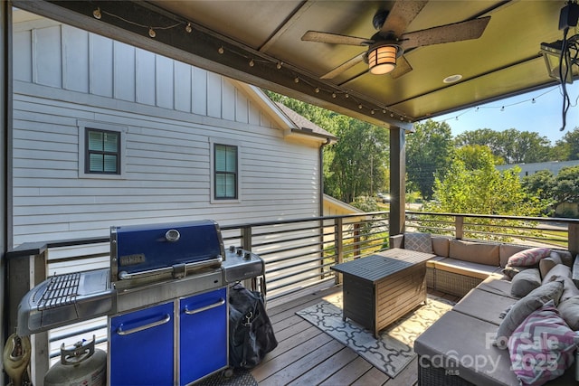 wooden terrace featuring an outdoor living space, ceiling fan, and a grill