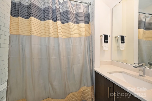 bathroom with vanity and a shower with curtain