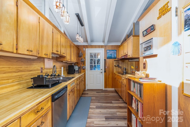 kitchen with beamed ceiling, dark hardwood / wood-style floors, dishwasher, pendant lighting, and sink