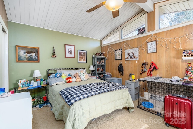 bedroom featuring ceiling fan, carpet floors, wood walls, and vaulted ceiling with beams