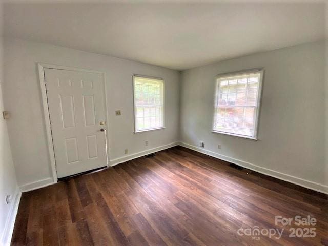 foyer entrance with dark hardwood / wood-style flooring