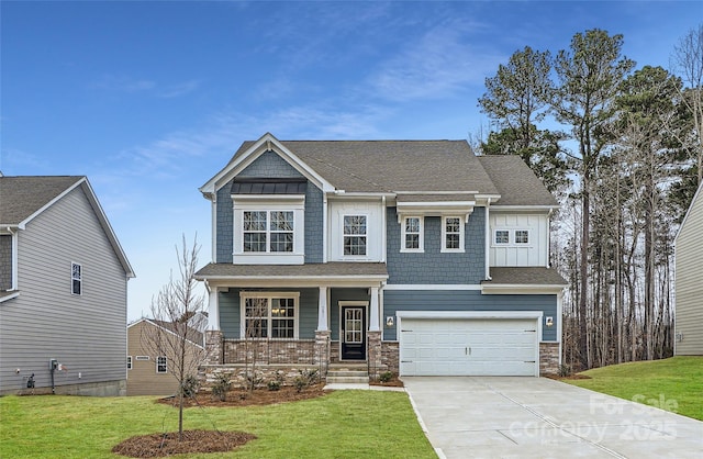 craftsman-style house with covered porch, a garage, and a front lawn