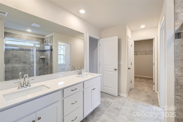 bathroom with vanity and walk in shower