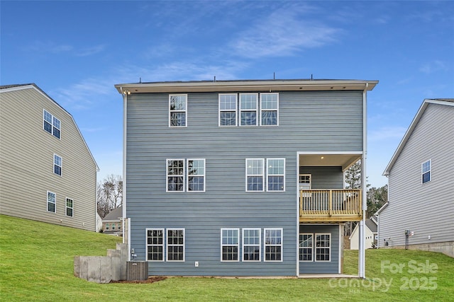 back of property featuring cooling unit and a yard