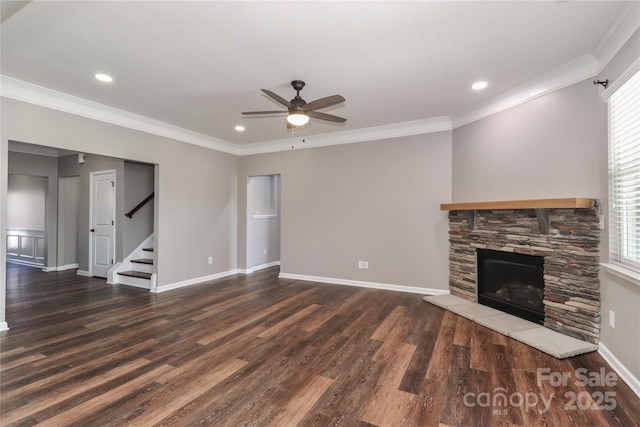 unfurnished living room featuring a fireplace, dark hardwood / wood-style flooring, ceiling fan, and a healthy amount of sunlight