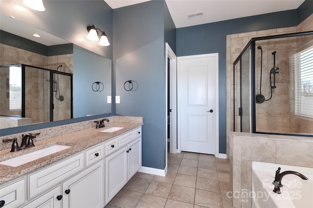 bathroom featuring tile patterned floors, vanity, and separate shower and tub