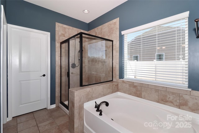 bathroom featuring tile patterned floors and plus walk in shower