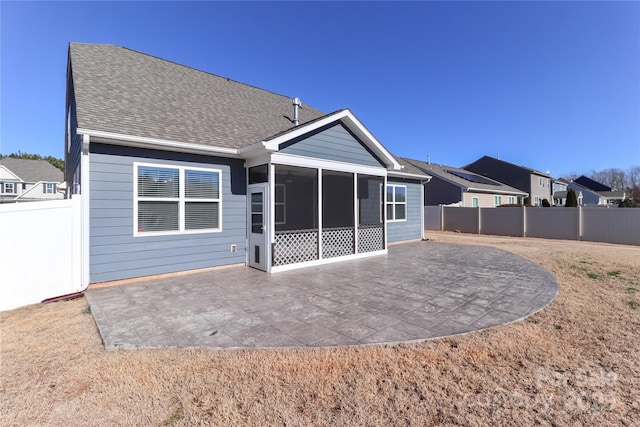 back of house with a patio and a sunroom