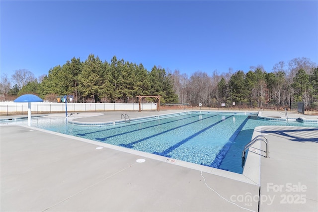 view of pool with a patio area and central AC unit