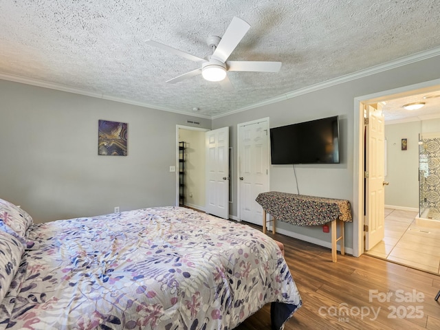 bedroom featuring wood-type flooring, a textured ceiling, ceiling fan, and crown molding