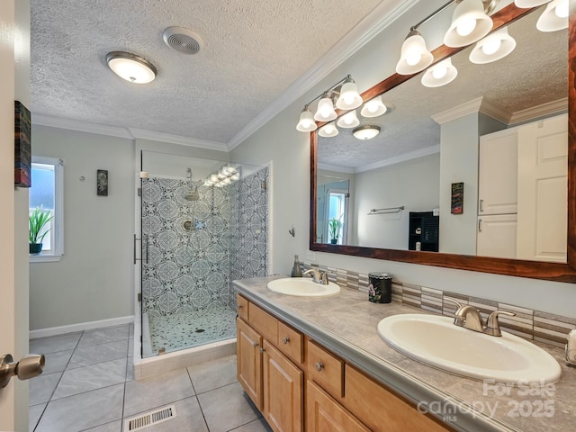 bathroom with a tile shower, tile patterned floors, plenty of natural light, and ornamental molding