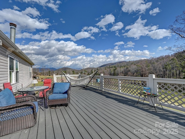 wooden deck featuring a mountain view