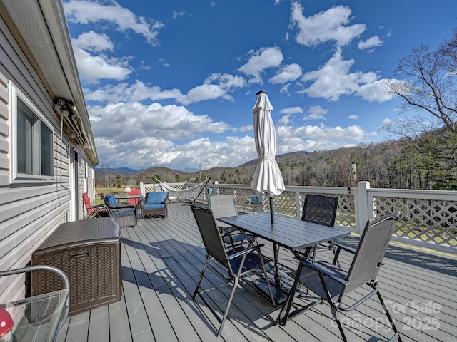 wooden terrace with a mountain view