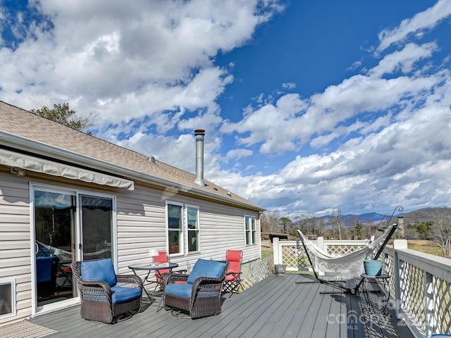 wooden deck with a mountain view