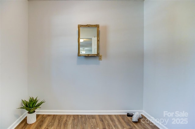 empty room featuring hardwood / wood-style flooring