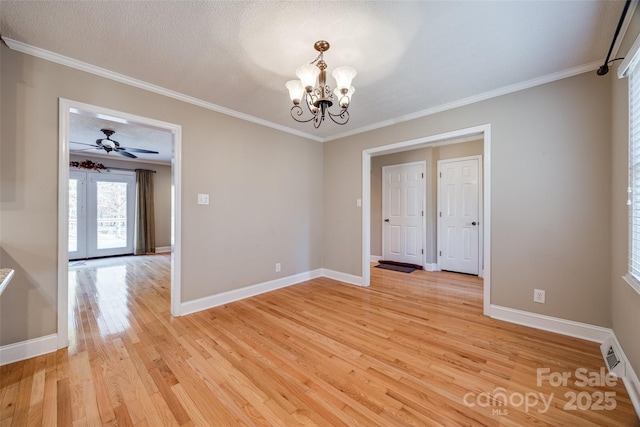 unfurnished room featuring ceiling fan with notable chandelier, a textured ceiling, light hardwood / wood-style flooring, and ornamental molding