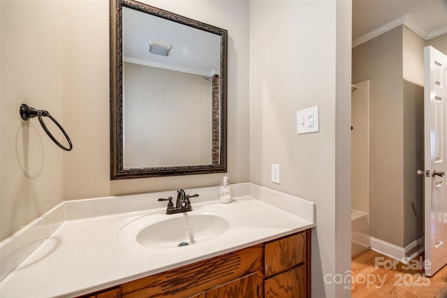 bathroom with vanity, shower / washtub combination, and ornamental molding