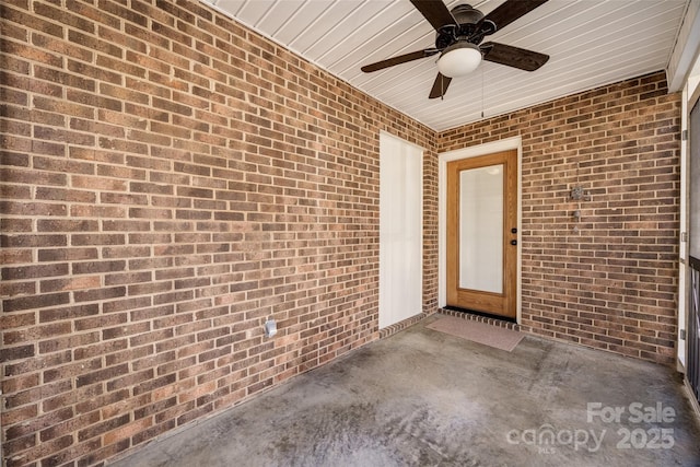 view of exterior entry with ceiling fan