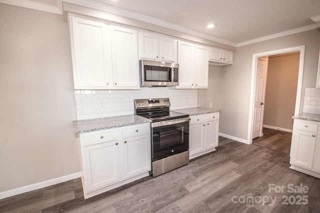 kitchen featuring backsplash, light stone counters, white cabinets, and stainless steel appliances