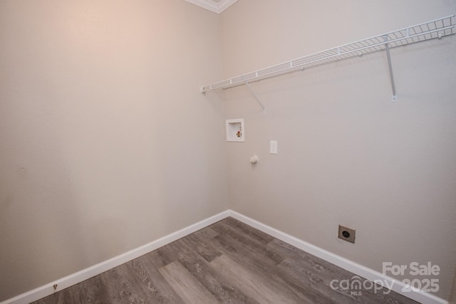 laundry area featuring crown molding, hookup for a washing machine, hardwood / wood-style flooring, and hookup for an electric dryer