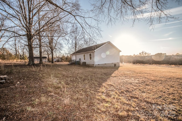 view of property exterior with a rural view