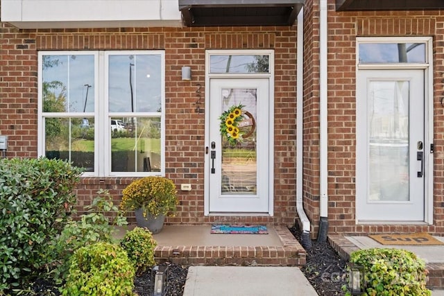 entrance to property with brick siding