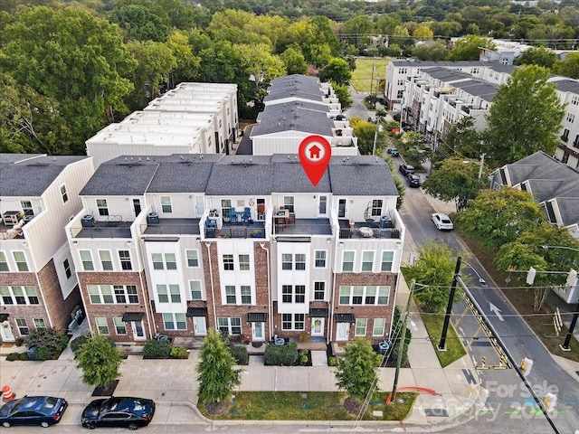 birds eye view of property with a residential view