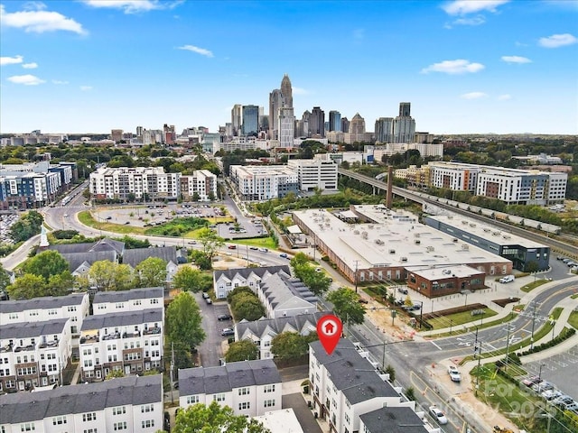 birds eye view of property with a view of city