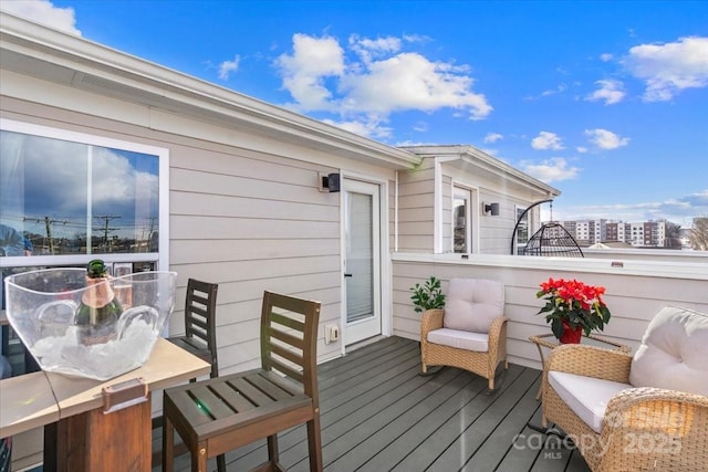 deck with outdoor dining area