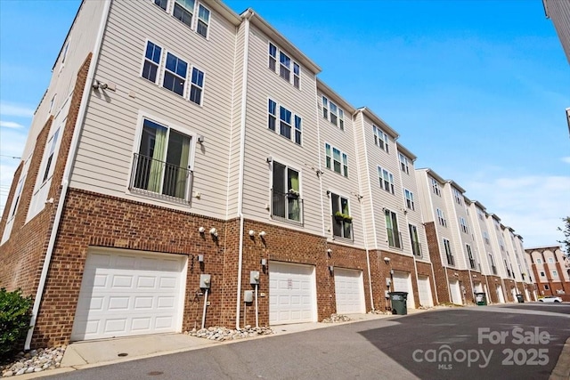 view of building exterior featuring an attached garage