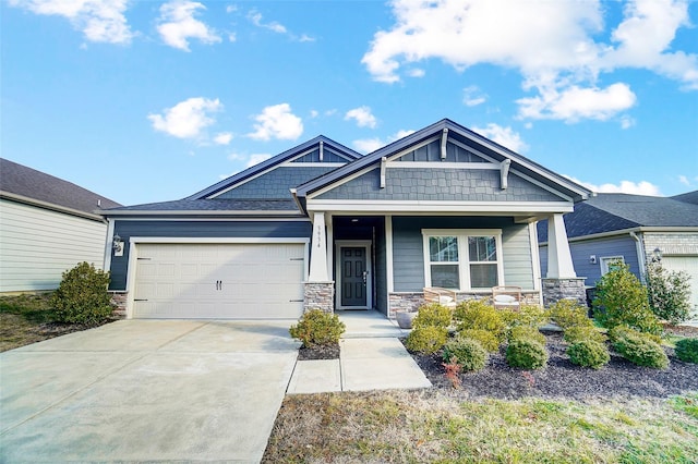 craftsman-style home with covered porch and a garage