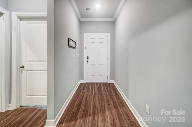 corridor featuring hardwood / wood-style flooring and crown molding