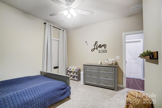 carpeted bedroom with ceiling fan