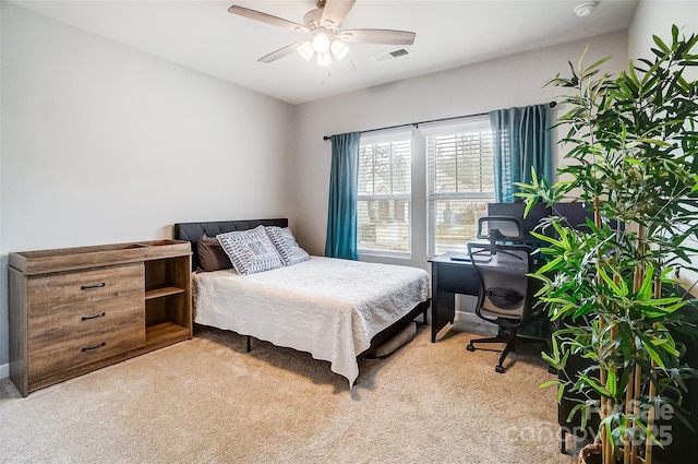 carpeted bedroom with ceiling fan