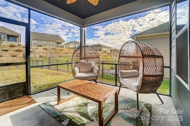 sunroom / solarium with ceiling fan