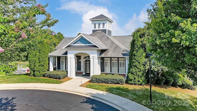 view of front of home with a front lawn