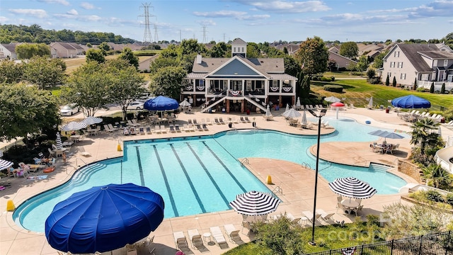 view of swimming pool with a patio area