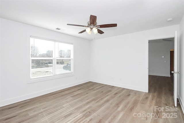 empty room featuring ceiling fan and light wood-type flooring