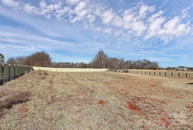 view of yard with a rural view