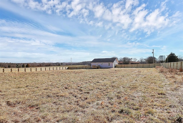 view of yard with a rural view