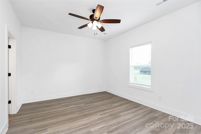 2365 28th St NE, Hickory, NC 28601 - unfurnished room featuring baseboards, visible vents, and wood finished floors