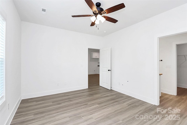 2365 28th St NE, Hickory, NC 28601 - unfurnished bedroom featuring baseboards, light wood-style floors, and visible vents