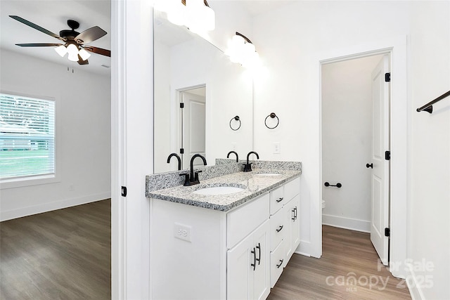 2365 28th St NE, Hickory, NC 28601 - full bathroom with a sink, ceiling fan, baseboards, and wood finished floors