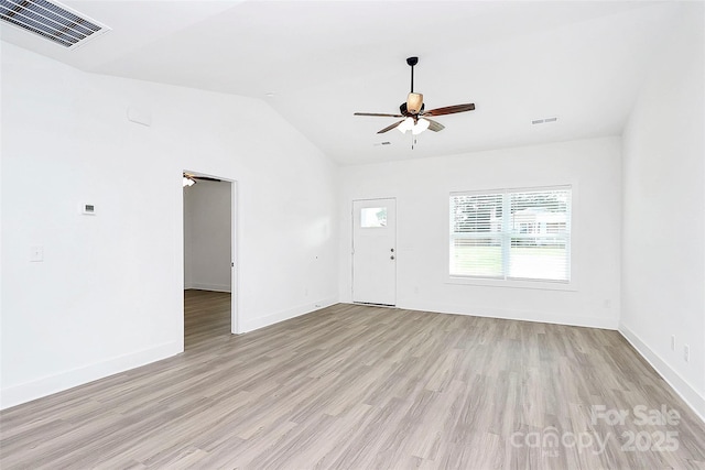2365 28th St NE, Hickory, NC 28601 - unfurnished living room with vaulted ceiling, light wood-type flooring, visible vents, and a ceiling fan