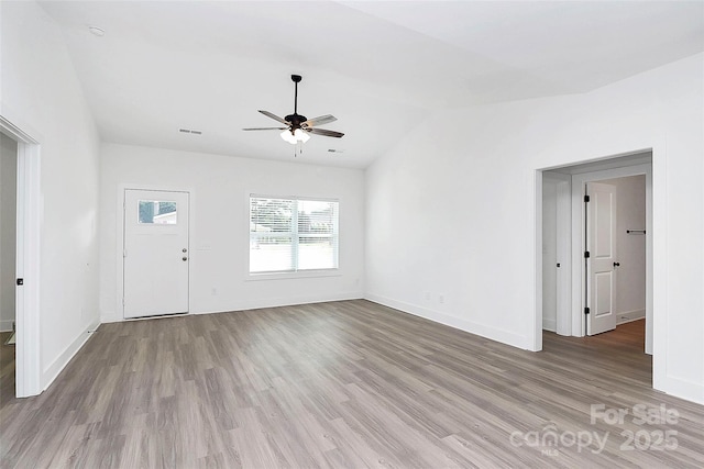 2365 28th St NE, Hickory, NC 28601 - unfurnished living room featuring ceiling fan, light wood-style flooring, baseboards, and visible vents