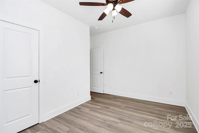 2365 28th St NE, Hickory, NC 28601 - spare room featuring ceiling fan, baseboards, and light wood-style floors