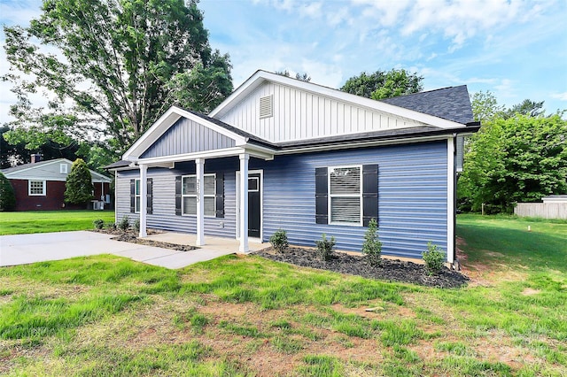 2365 28th St NE, Hickory, NC 28601 - view of front of property with board and batten siding, a patio area, and a front lawn