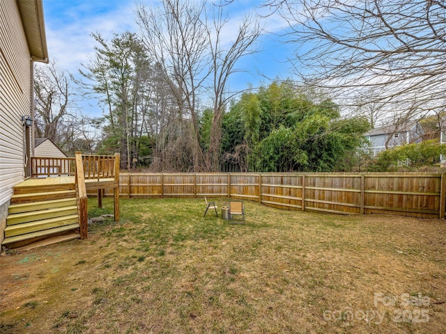 view of yard with a wooden deck